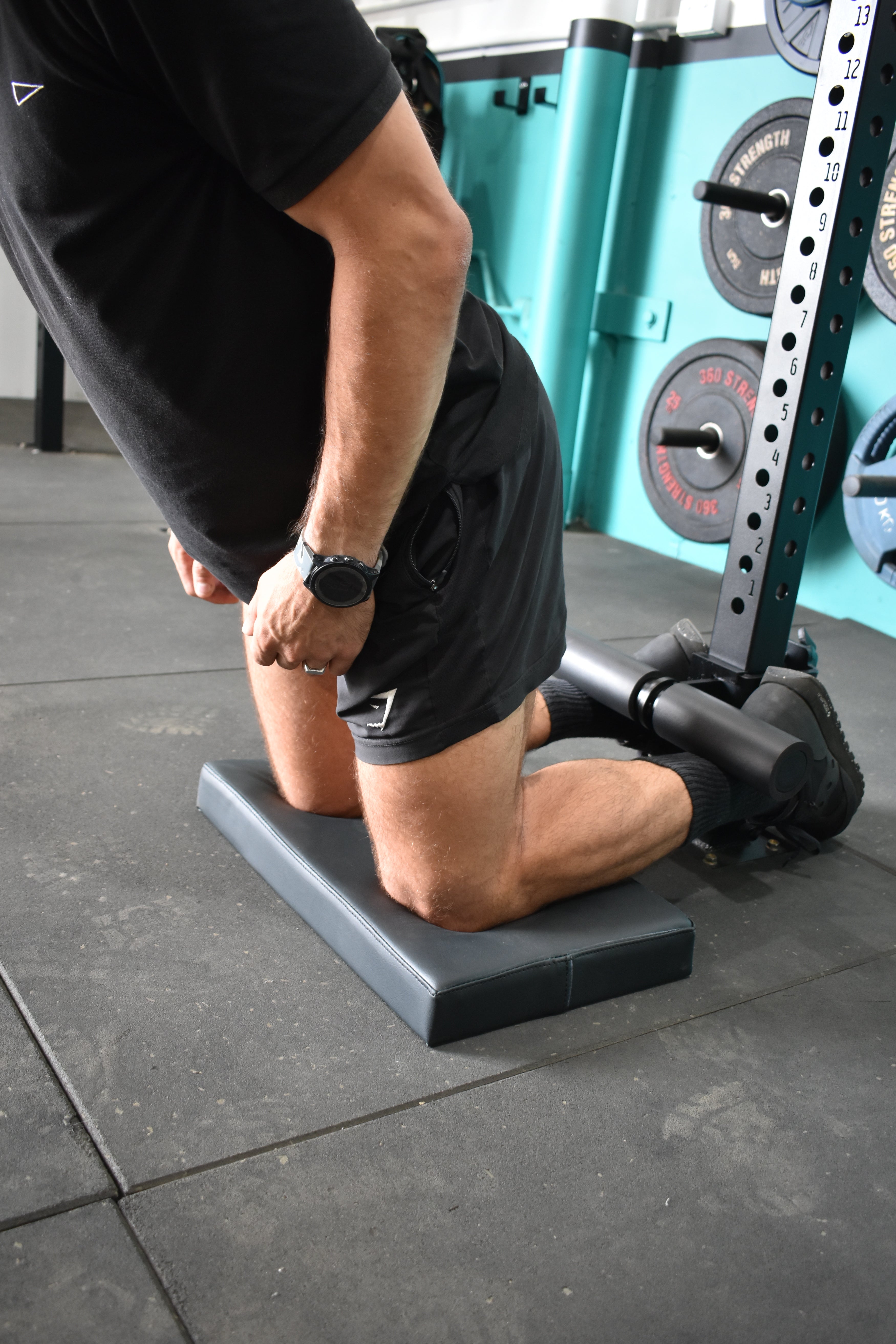 Hamstring curls on the Nordic Pad